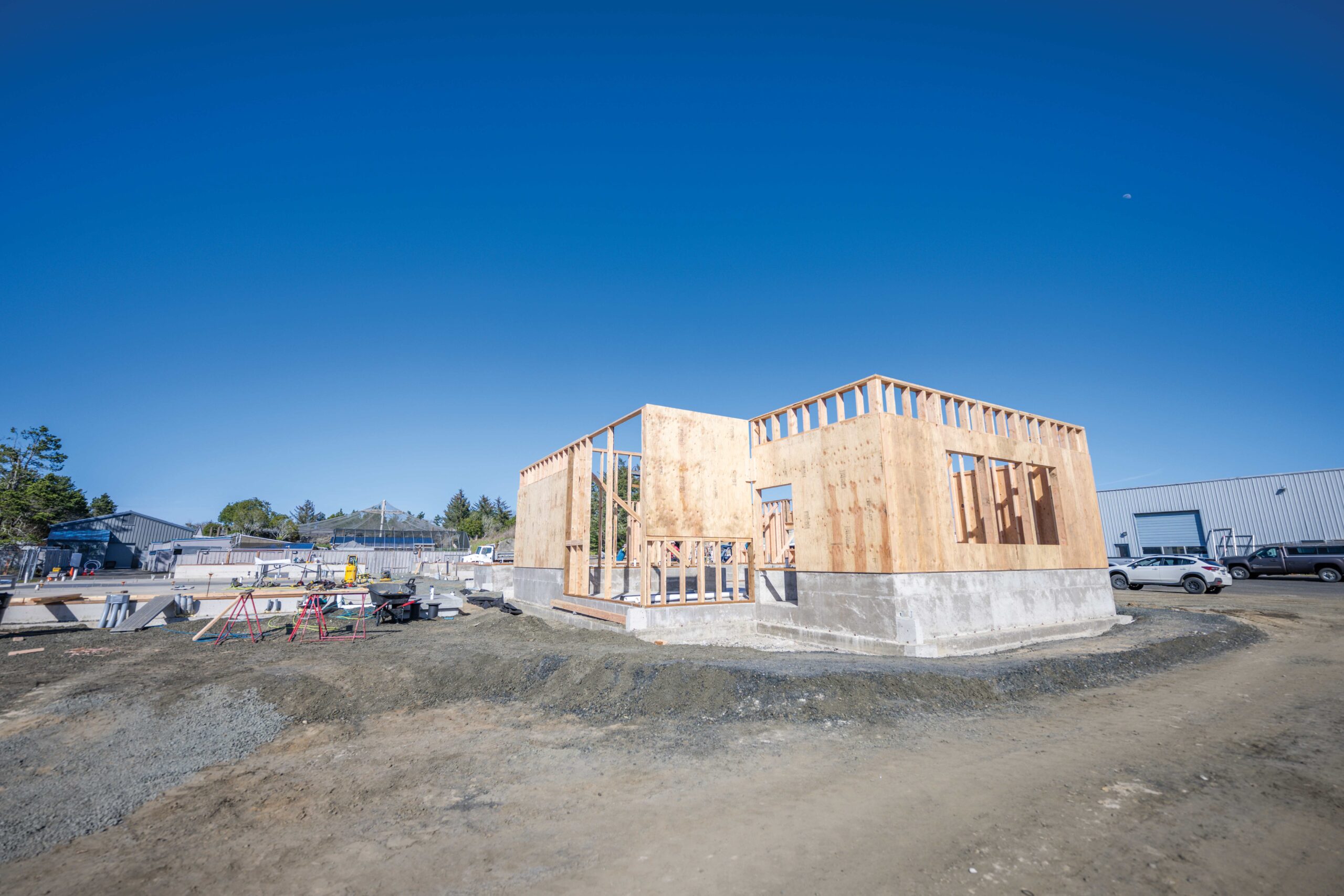 A wide angle view shows the Marine Wildlife Rehabilitation construction site. The foundation and framework is prominent.